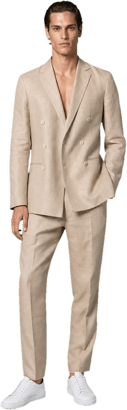 A sand-coloured double-breasted linen suit worn with the collar open and no tie, with clean white leather sneakers